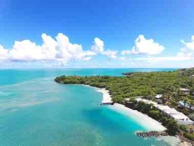 Aerial view of a tropical coastline with turquoise sea and white sandy beaches
