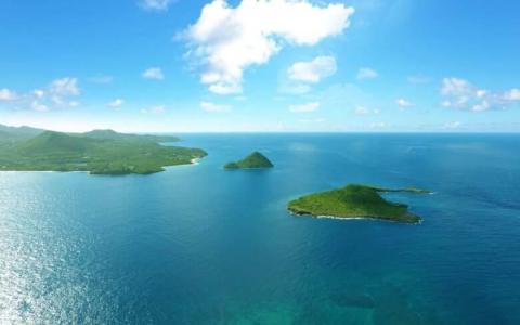 Aerial view of tropical islands with lush greenery and clear blue waters