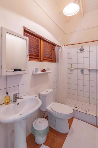 Elegant bathroom with sink, toilet, bidet, and tiled shower area