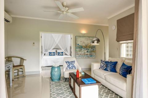 Stylish coastal-themed bedroom with blue and white decor and sea motifs
