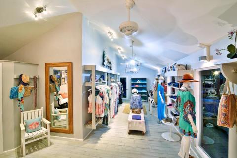 Stylish boutique interior with summer clothing and modern decor