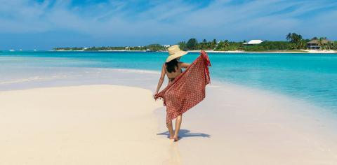 The image shows a beautiful tropical beach scene