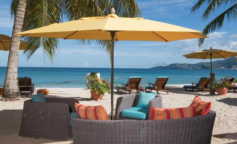 Serene Beach Lounge With Ocean View Serene beach with yellow umbrellas, lounge chairs, and ocean view, perfect for relaxation.