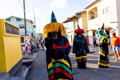 Traditional Festival Costumes Parade Scene Colorful traditional costumes in a festive Caribbean street procession