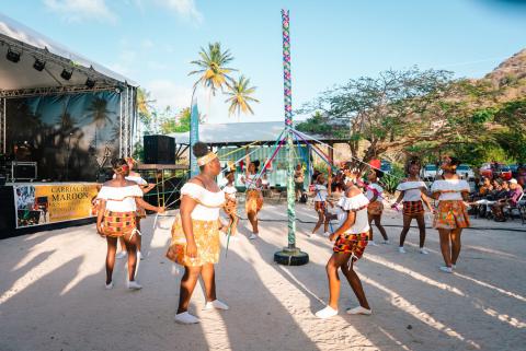 Carriacou Maroon Festival Dance Performance Carriacou Maroon Festival dancers around Maypole in traditional attire