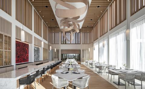 Modern Luxury Dining Interior With Artistic Design Luxurious dining hall in upscale hotel with artistic decor and natural lighting