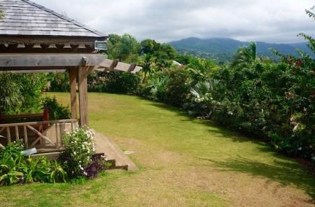 Scenic Garden Landscape With Gazebo And Hills Scenic garden with lush foliage, gazebo, and distant hills, ideal for relaxation.