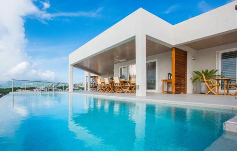 Luxury Villa With Infinity Pool And Ocean View Luxurious villa with infinity pool overlooking lush landscape and ocean