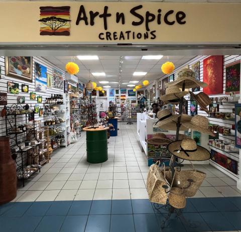 Art N Spice Creations Shop Interior With Crafts Art n Spice Creations shop interior with spices, artworks, and straw hats on display.