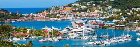 Vibrant Coastal Town With Busy Port And Yachts Colorful coastal town with a busy port, luxury yachts, and clear waters