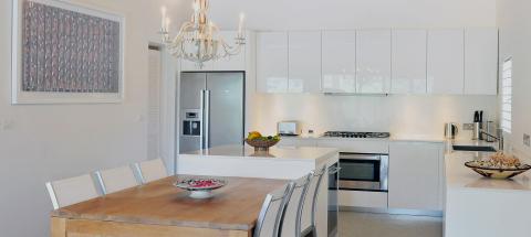 Modern kitchen and dining area with elegant decor and natural light