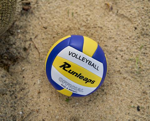 Official size Runleaps volleyball in blue and yellow on sand