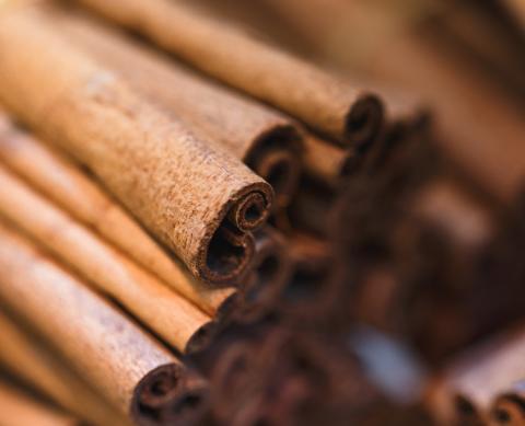 Close-up of aromatic brown cinnamon sticks used in global cuisines and beverages.