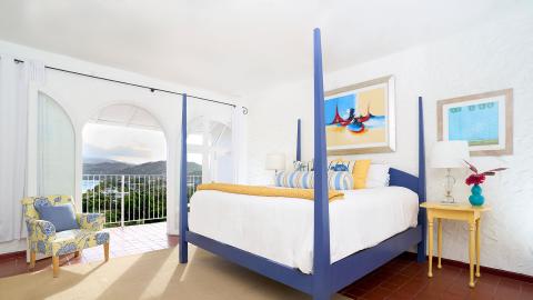 Brightly decorated bedroom with scenic view and stylish furnishings
