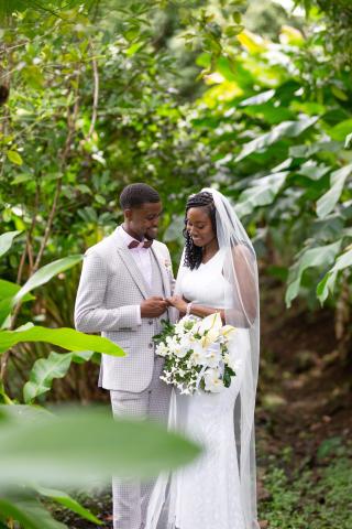 Bride and groom enjoying a moment in a lush garden setting