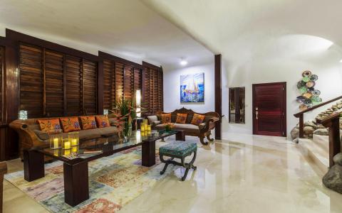 Traditional and contemporary styled room with wooden elements and colorful decor.