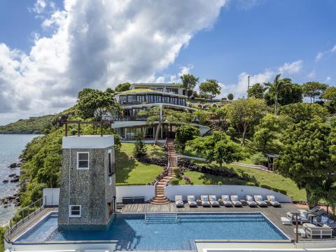 Luxurious coastal residence with pool and terraces overlooking bay