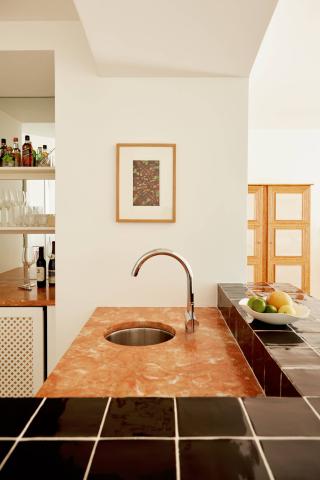 This image shows a stylish kitchen interior with a modern design