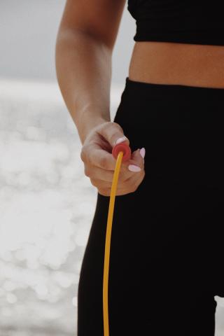 This image shows a close-up of a person, prominently displaying their torso and hand
