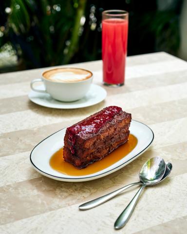 The image showcases a table setting with a delicious dessert and beverages