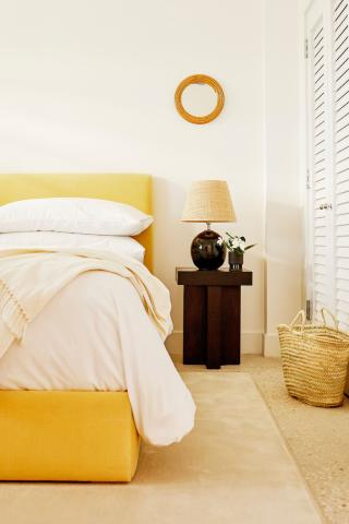 The image depicts a neatly organized bedroom corner