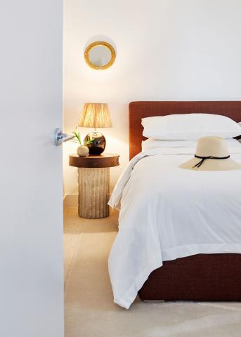 The image shows a neatly arranged bedroom corner
