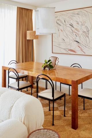 The image shows a stylish dining room setting