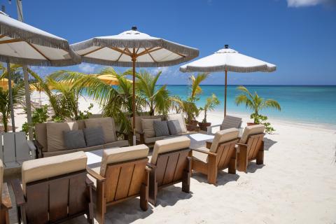 The image shows a beautiful beach setup perfect for relaxation