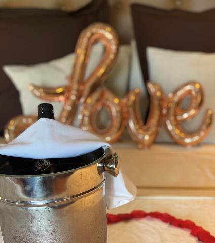 Chilled champagne in ice bucket with rose gold 