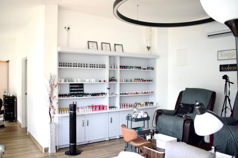 Modern nail salon interior with manicure and pedicure stations