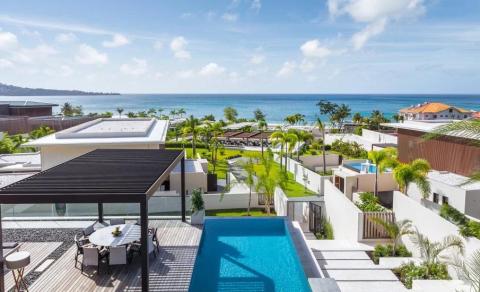Luxury residential area with private pool and ocean view in tropical setting