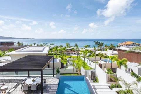 Luxurious seaside resort with private pool, villas, and ocean view