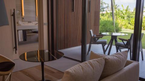 Modern luxury home interior with patio view, stylish furnishings, and seamless design.
