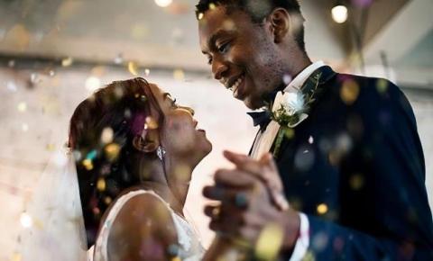 Bride and groom sharing a joyful dance at their wedding reception.
