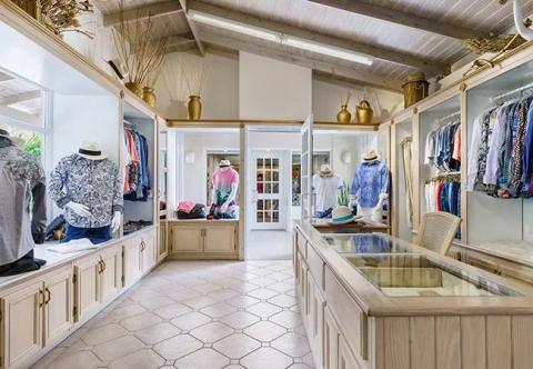Elegant clothing boutique interior with mannequins and stylish outfits displayed