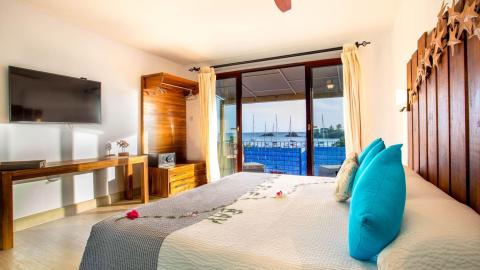Modern hotel room with sea view, stylish decor, and a cozy ambiance.