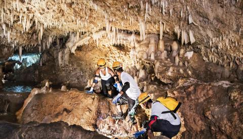 Barbados Cave Adventure with Explorers Visitors exploring a cave in Barbados