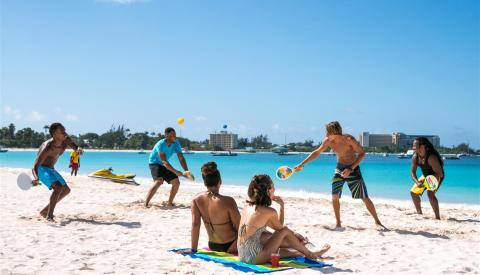Barbados beach fun and water activities People enjoying beach activities in Barbados