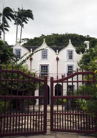 Barbados Heritage: A Glimpse into Architectural History Historic building in Barbados with tropical flora