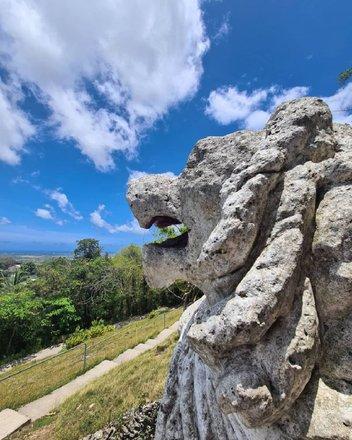 Barbados Stone sculpture in Barbados with scenic backdrop