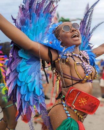Barbados Carnival Reveler in Vibrant Attire Woman celebrating in colorful costume
