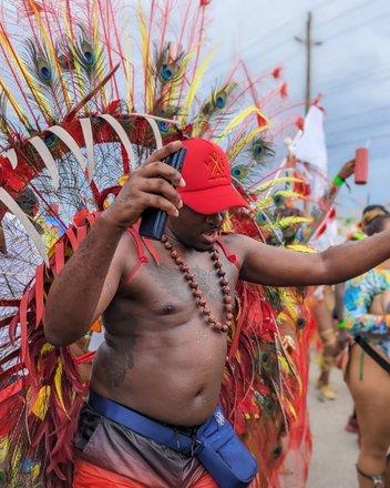 Barbados Celebration of Culture in Full Color A man participating in a vibrant Barbadian cultural event
