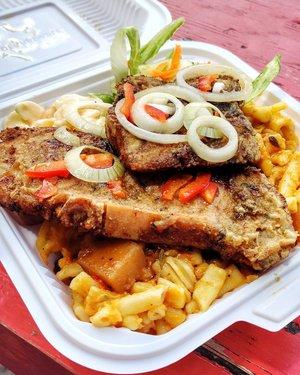 Barbados Delights: Savory Local Cuisine Traditional Bajan cuisine served in a takeout container