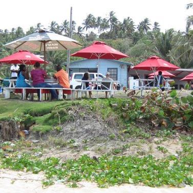 Barbados Seaside Dining Experience Beachside eatery with people in Barbados