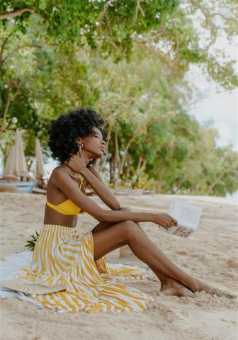Barbados Beach Leisure - Serenity by the Sea Woman relaxing on a beach in Barbados