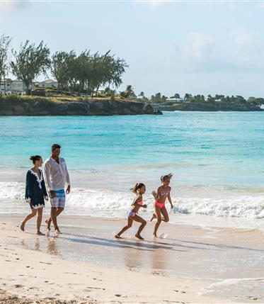 Barbados: Family Fun at a Beautiful Beach Family enjoying time on a Barbados beach