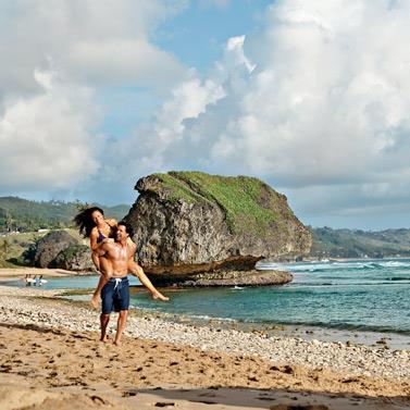 Barbados Beach Fun with Scenic Ocean Views Couple enjoying time on a beach in Barbados
