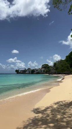 Barbados Beach Paradise: Crystal Clear Waters and Pristine Sands Serene beach scene in Barbados with clear waters
