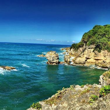 Barbados: Stunning View of a Rocky Coastline and Blue Waters Beautiful coastal landscape of Barbados with clear blue water