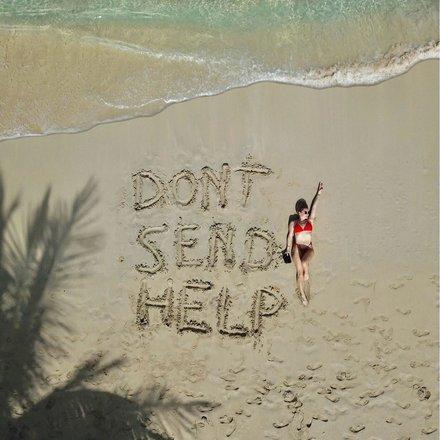 Barbados Beach Fun with a Twist Beach scene in Barbados with playful message in the sand